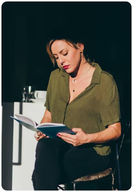 Author reviewing a manuscript at her desk